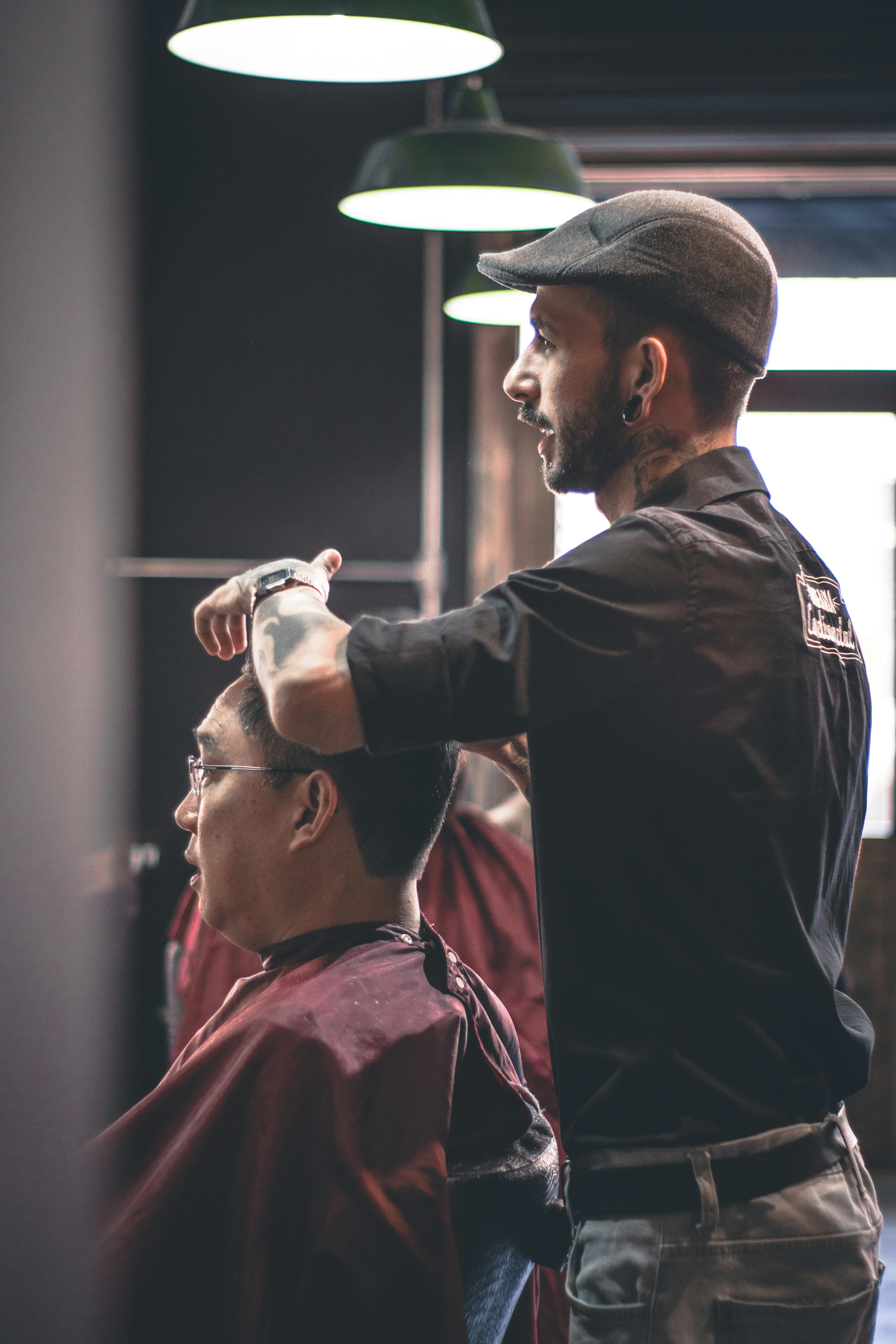 barbers cutting hair